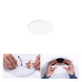Round white LED ceiling light made of plastic with mounting clips, easy installation and modern design