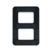 Black plastic panel with rectangular cutouts and fine lines for electronic device components