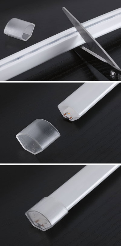 White plastic LED light strip with removable end caps and scissors for cutting to size
