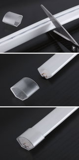 White plastic LED light strip with removable end caps and scissors for cutting to size
