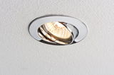 Round recessed spotlight with chrome metal frame in white ceiling for accent lighting