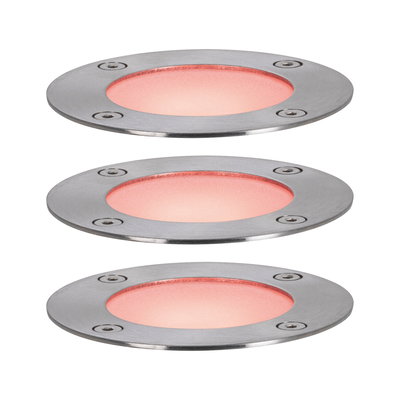 Trois spots encastrés ronds en acier inoxydable avec lumière rouge pour éclairage extérieur.