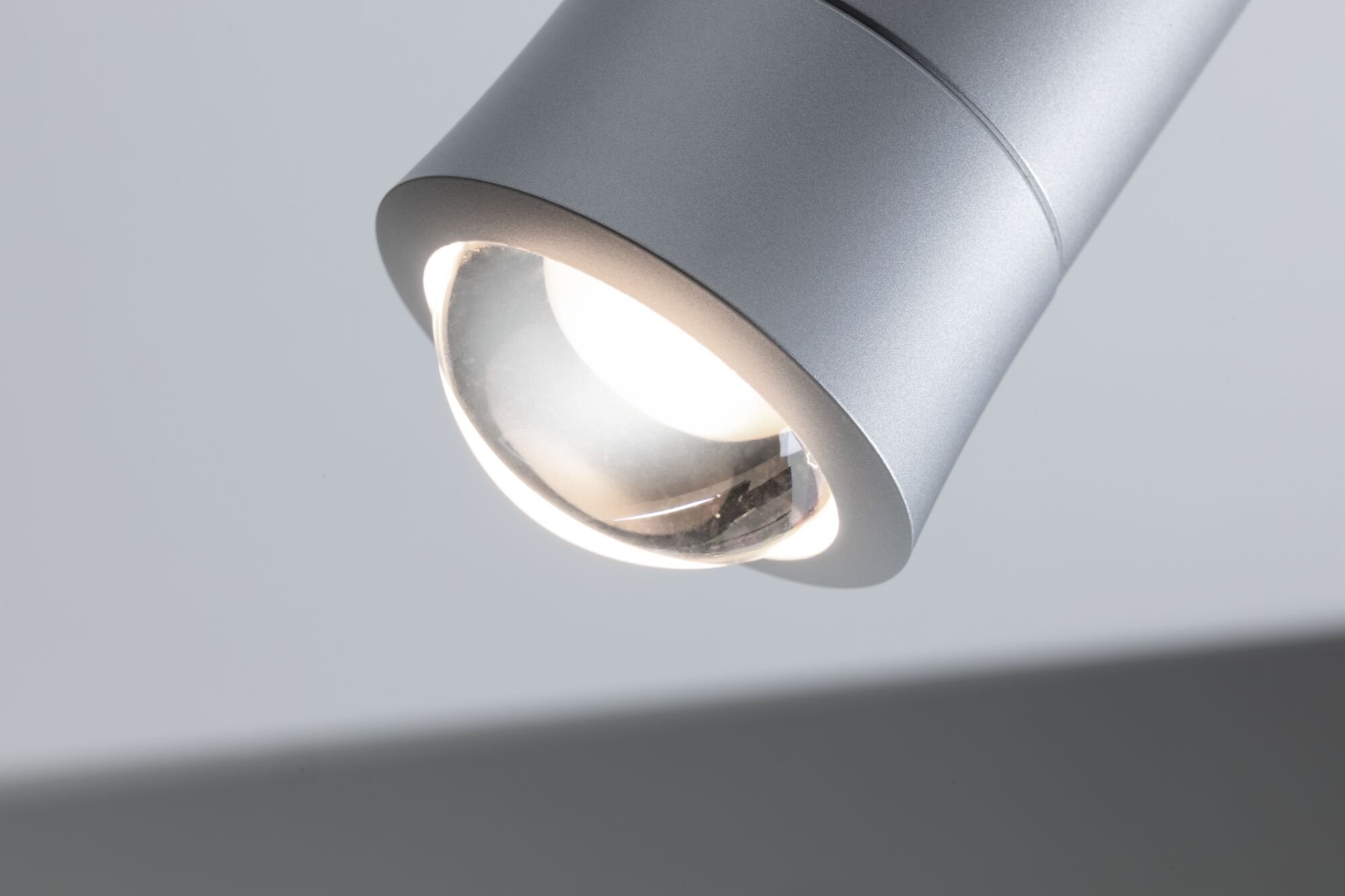Modern silver metal LED ceiling spotlight with focused light for living spaces