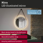Round LED illuminated mirror with black leather strap for modern bathroom design