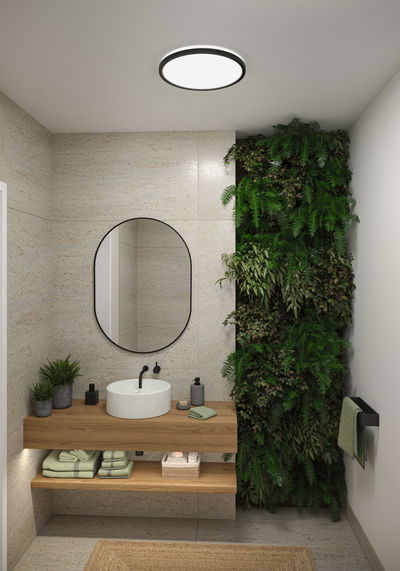 Rund LED-loftlampe med sort ramme i moderne badeværelse med trævask og grøn plantevæg