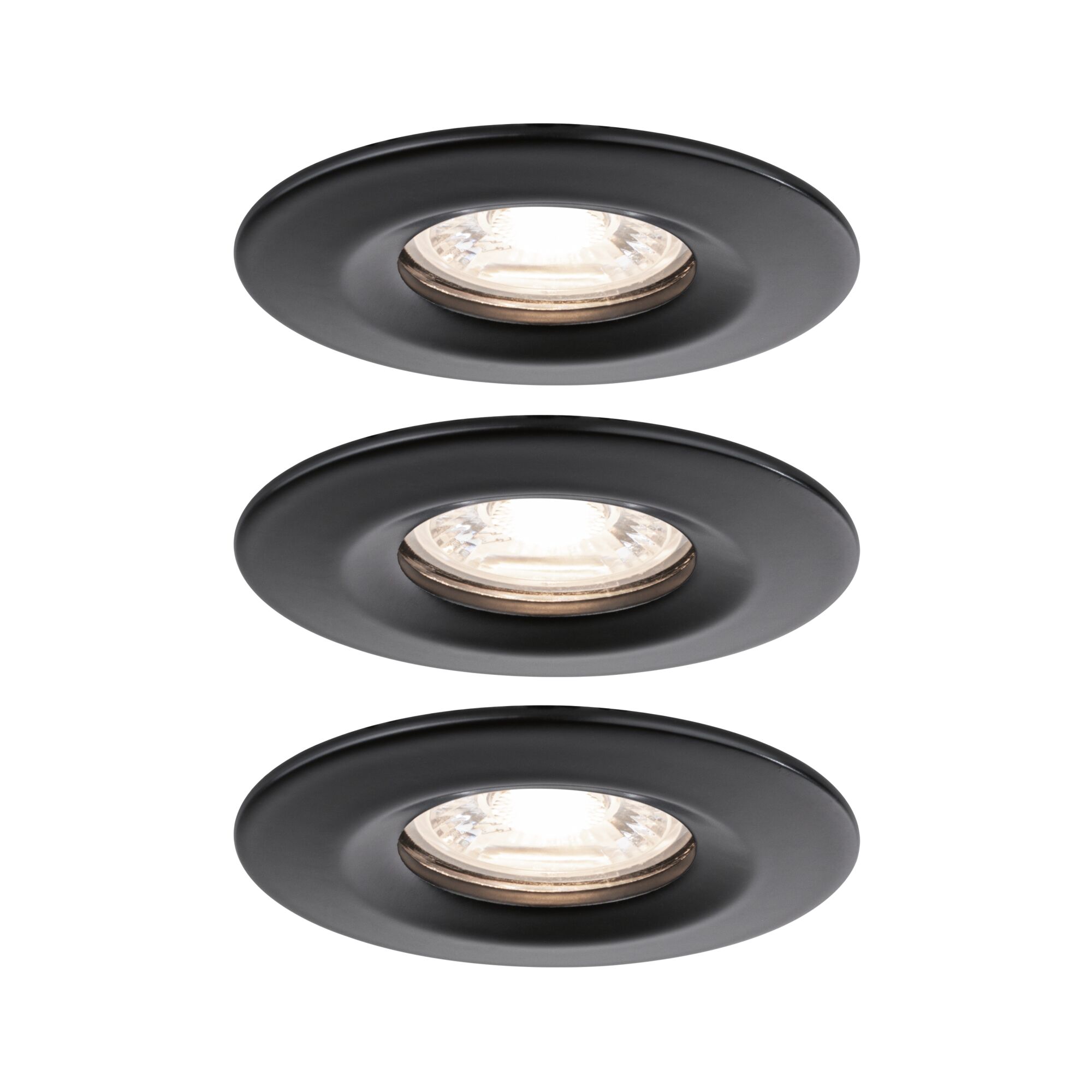 Three round recessed spotlights in matte black metal with warm white light for modern indoor lighting