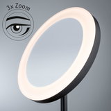 Round cosmetic mirror with LED ring light and 3x zoom in black for precise makeup application.