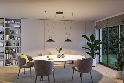 Moderne spisestue med hvidt ovalt bord, grå stole og sorte metalpendellamper