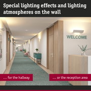 Modern hallway with white wall lights and wood accents creating ambient lighting in reception area