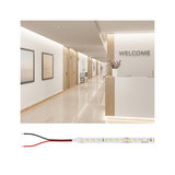 LED light strip with white LEDs and black and red wires for modern indoor lighting solutions