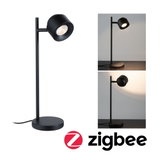 Black metal LED desk lamp with round base and adjustable head for modern lighting and smart home use