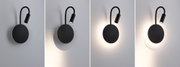 Black LED wall light with flexible reading arm and warm white light for modern interiors