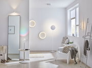 Modern living room with white metal wall lights and floor lamp, minimalist interior design