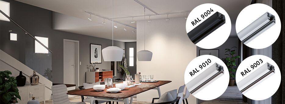 Modern dining room with wooden table and white pendant lights, displaying various RAL colors for rail systems.