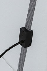 Black electrical connector box on grey textile cable for LED lighting systems