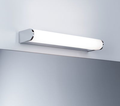 Modern white LED wall light with chrome accents above mirror for bathroom lighting