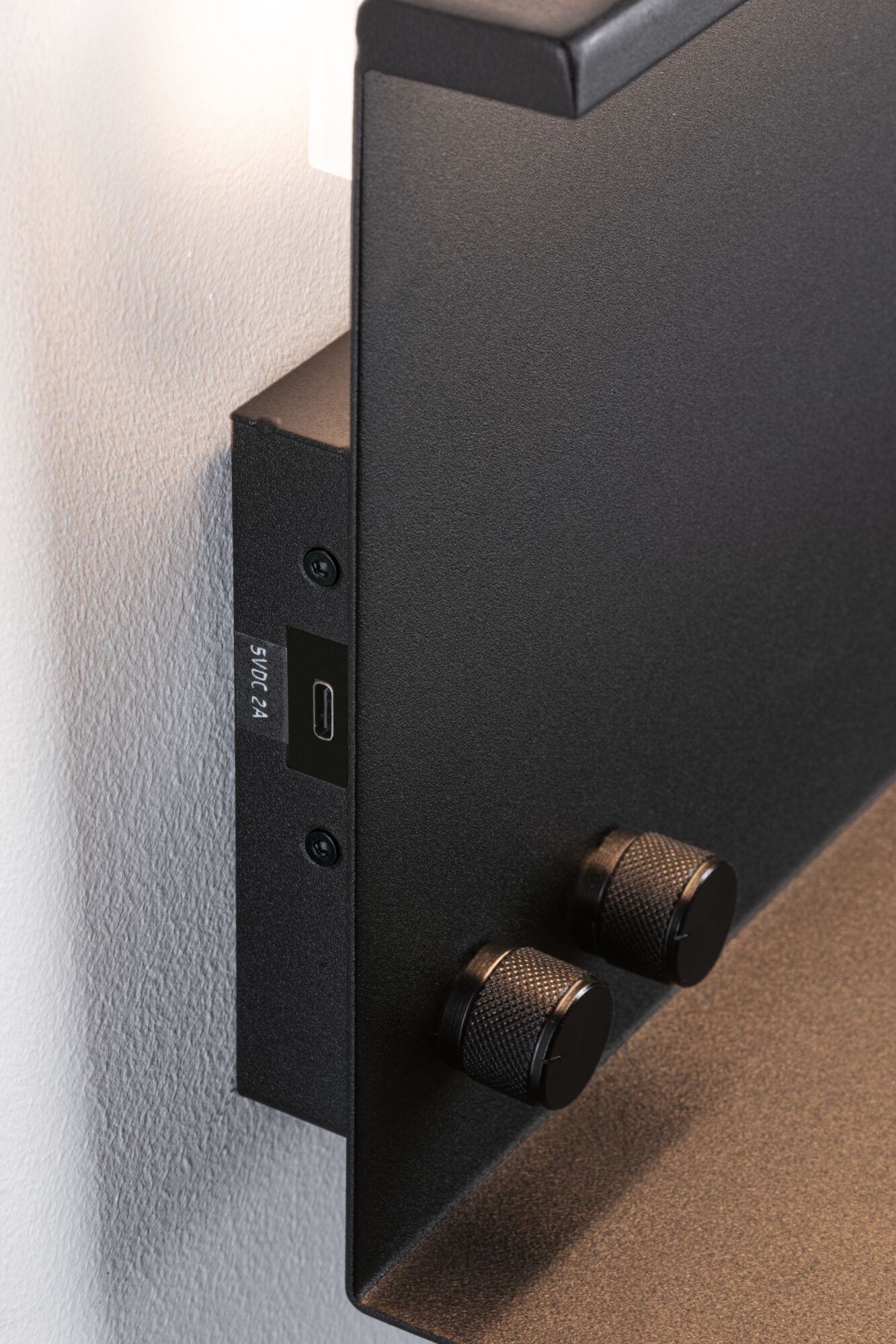 Black metal wall light with two textured rotary knobs and USB-C port for LED lighting control.