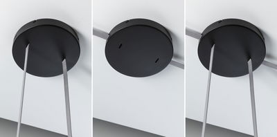Schwarze runde Deckenbefestigung aus Metall mit grauen Textilkabeln für moderne Beleuchtungssysteme.