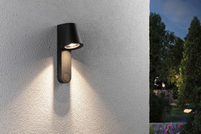 Black metal outdoor wall light with warm white LED for garden and terrace lighting.