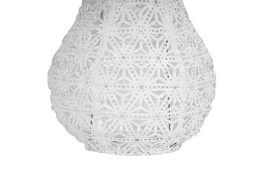 White lampshade with perforated floral pattern made of lightweight material for decorative lighting