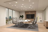 Modern conference room with grey office chairs and white table on grey carpet, LED ceiling lights