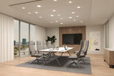 Modern conference room with grey office chairs and white table on grey carpet, LED ceiling lights