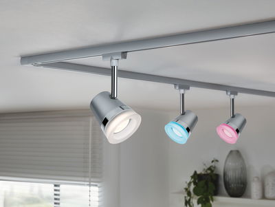 Three-light LED track with silver spotlights and colored rings in blue, white, and pink for home lighting