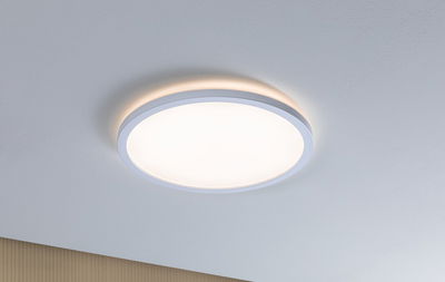 Round white LED ceiling light with warm white glow and modern design for living spaces