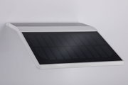 White casing with black solar panel for energy-efficient outdoor lighting solution
