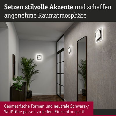 Moderne Wandlampen in Schwarz-Weiß mit geometrischem Design schaffen stilvolle Akzente im Flur.