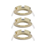Three round brushed brass recessed frames for LED spots, energy-efficient lighting fixtures