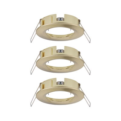 Three round brushed brass recessed frames for LED spots, energy-efficient lighting fixtures