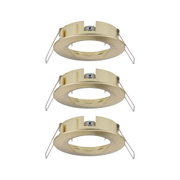 Three round brushed brass recessed frames for LED spots, energy-efficient lighting fixtures