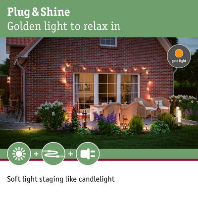 Cozy patio with golden Plug & Shine lights creating soft, candlelight-like outdoor ambiance