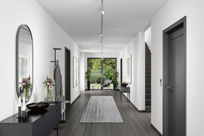 Moderner Flur mit grauem Boden, weißen Wänden, schwarzer Kommode und Paulmann LED-Deckenstrahlern.