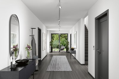 Moderner Flur mit grauem Boden, weißen Wänden, schwarzer Kommode und Paulmann LED-Deckenstrahlern.