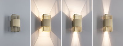 Moderner goldfarbener Metall-Wandleuchter mit Gitterdesign und variabler Lichtstreuung an weißer Wand