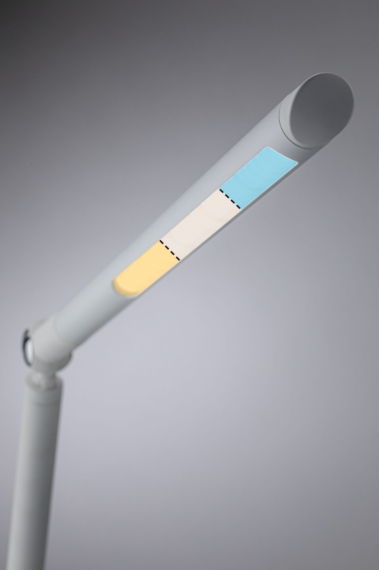 Modern white LED desk lamp with adjustable color temperature in blue, white, and yellow light.