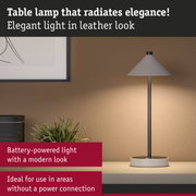 Modern battery-powered grey table lamp with leather look, elegant lighting solution without power connection