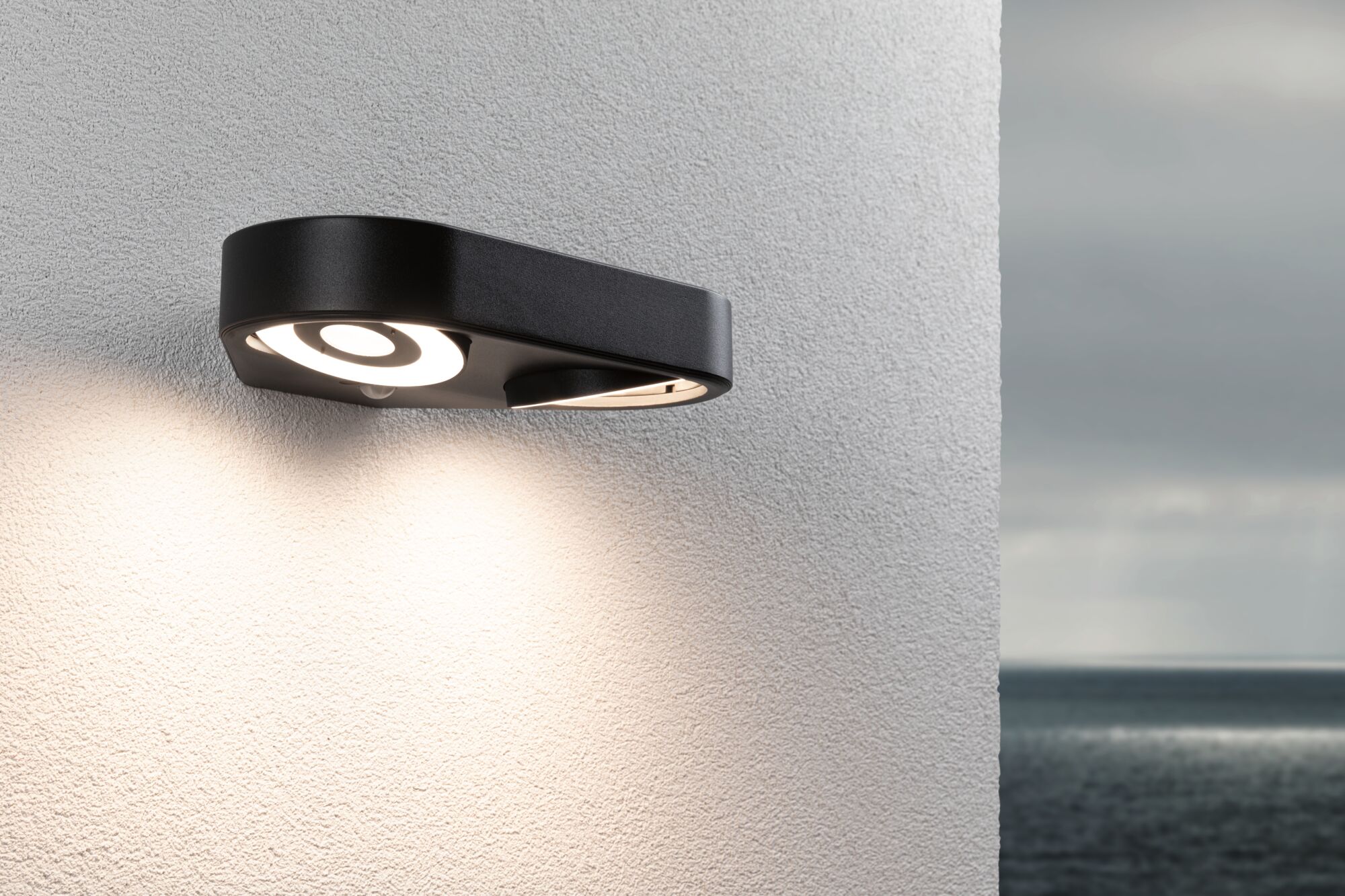Schwarze LED-Wandleuchte aus Metall mit rundem Lichtdesign, ideal für Außenbereiche und moderne Beleuchtung