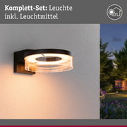 Schwarze Außenwandleuchte mit rundem Glas und warmweißem Licht für Garten und Terrasse