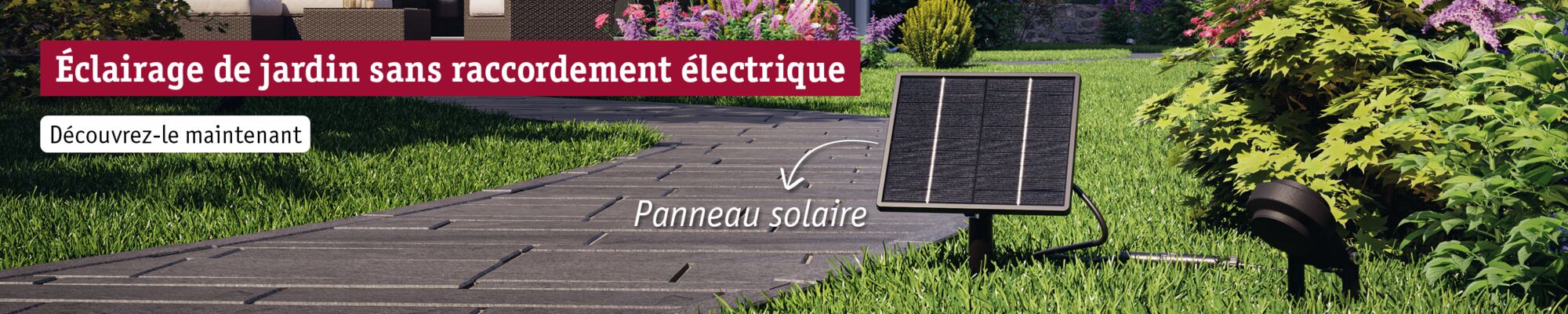 Éclairage de jardin solaire avec panneau noir et projecteur LED dans un jardin verdoyant