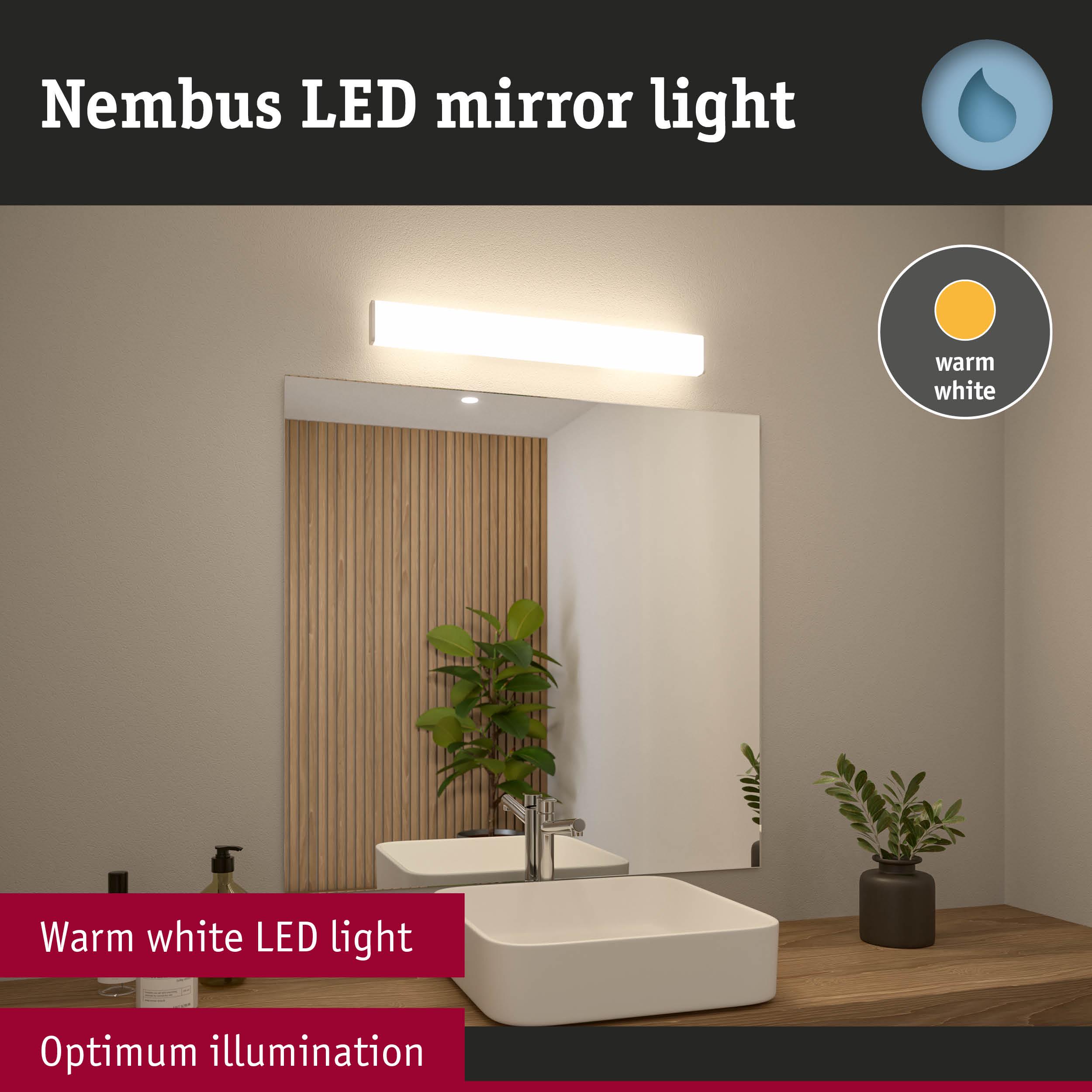 Nimbus LED mirror light in warm white above modern bathroom mirror with wooden shelf and plant