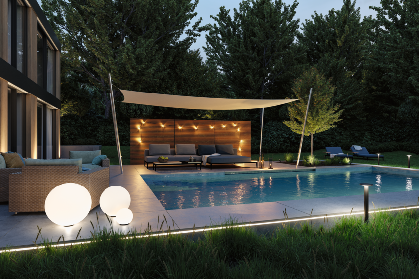 Modern outdoor pool with stylish LED lighting and seating area with sunshade in garden.