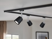 Black metal LED ceiling light with adjustable spotlights for modern room lighting