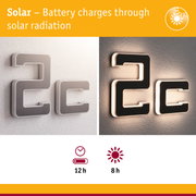 Solar-powered house number with black surface and white LED lighting for energy-efficient outdoor illumination