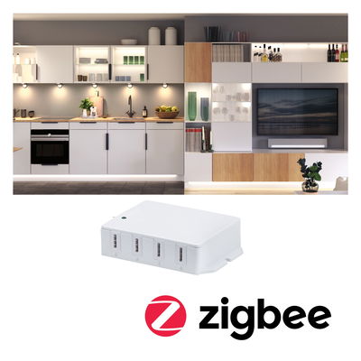 Weißes Zigbee-Steuergerät mit vier Anschlüssen vor moderner Küche und Wohnwand mit LED-Beleuchtung