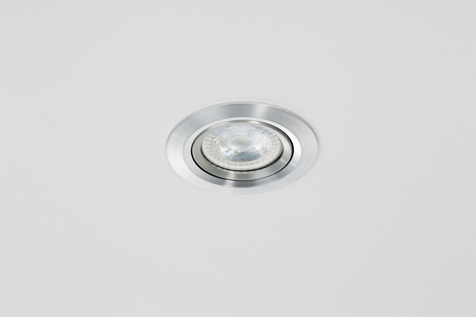 Round recessed spotlight in brushed aluminum silver for modern LED ceiling lighting
