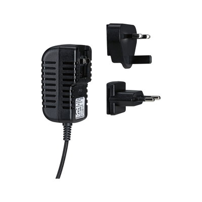 Black plastic power adapter with two interchangeable UK and EU plugs, electrical accessory