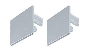 Two silver aluminium end caps for LED track lighting with simple plug-in mechanism